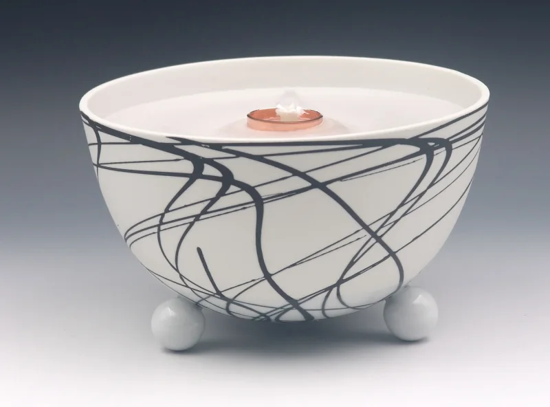 Schmelzlicht aus edlem Porzellan für drinnen und draußen